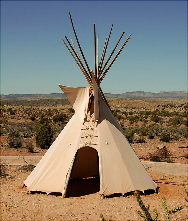 Photo 1.5, “Plains Indian Tepee,” is a contemporary color photograph of a tepee, taken on a clear day in the desert by photographer Naaman Abreu.